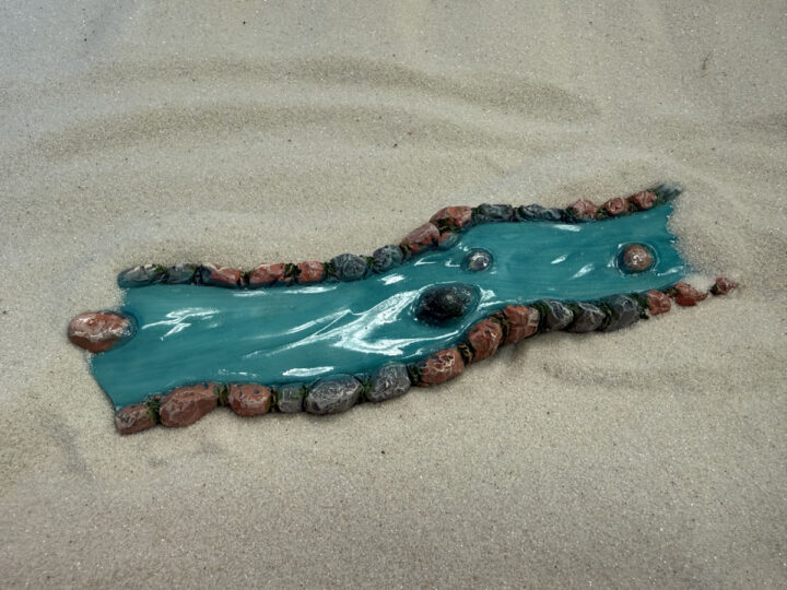 Small figuring of a river or stream for use in sandtray therapy in Ivy's office in Beaverton, OR