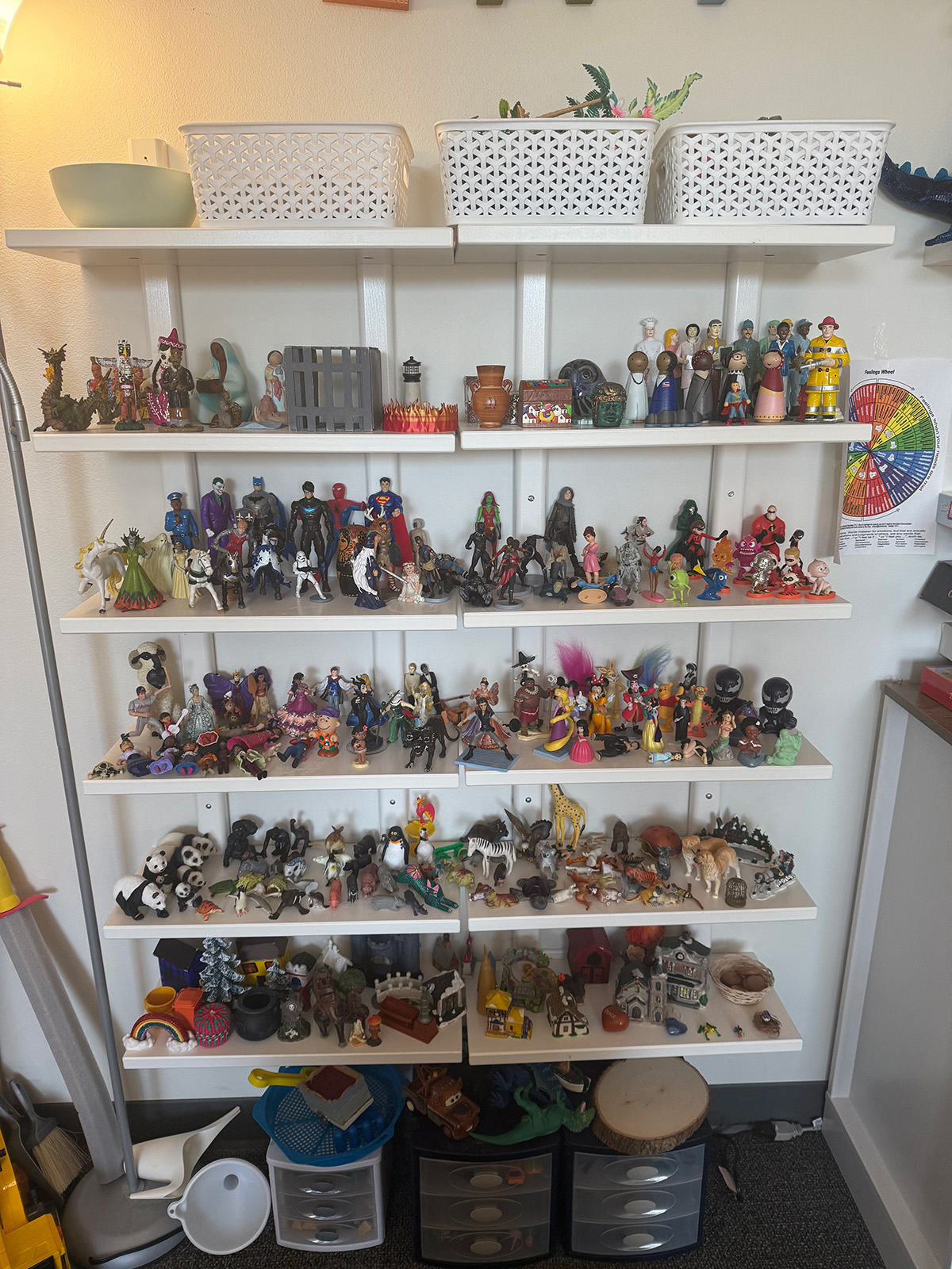 Shelves at Treehouse Counseling in Beaverton, filled with options for sandtray therapy